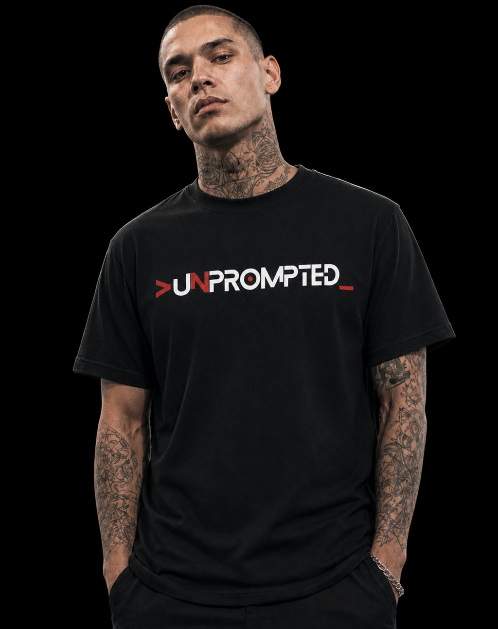 Person wearing a black t-shirt with 'UNPROMPTED' text design on a plain background